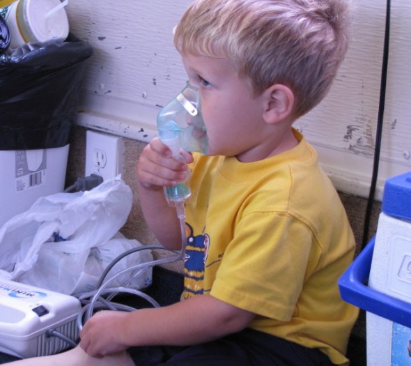 Jacob with a nebulizer for his wheezing