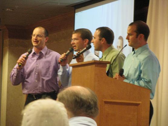 Marcus sings with his brothers and brother-in-law at Life Ministries Banquet.