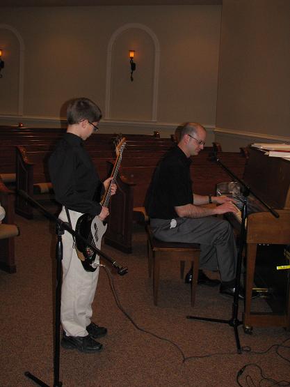 bryce-guitar Bryce is learning to play bass guitar for the best teacher you could ask for--his dad!