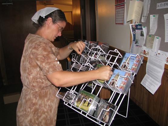 Sheryl setting up the CD rack.