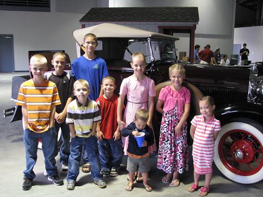 The children waiting for the auction to start, in the new, bigger facility.